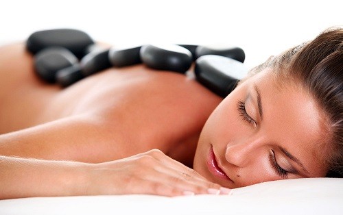 Woman enjoying a hot stone massage