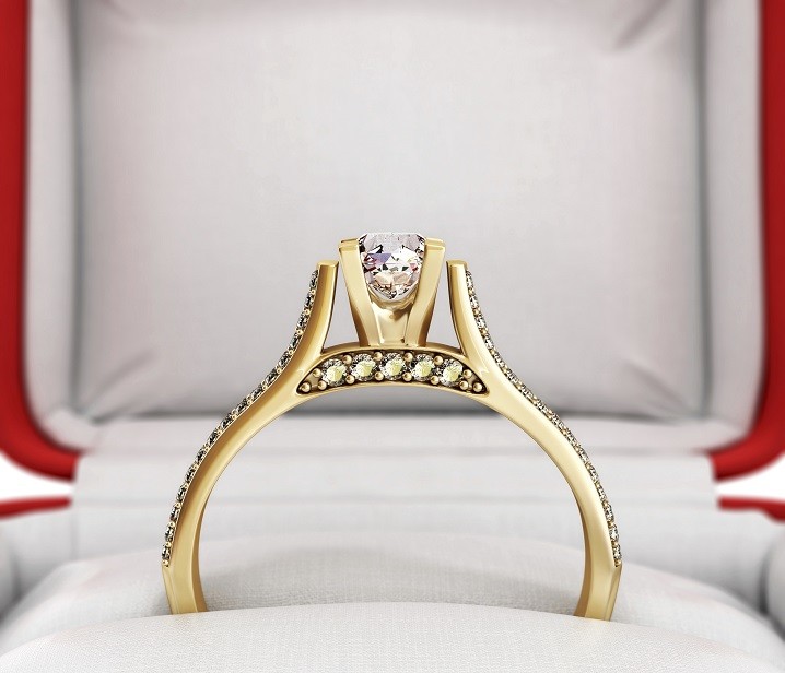 3d ilustration of gold engagement ring in a gift box on white background