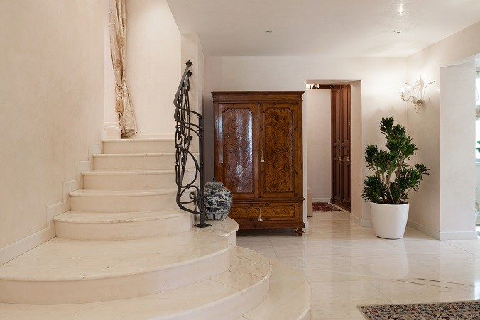 Hall of a luxury mansion, marble staircase